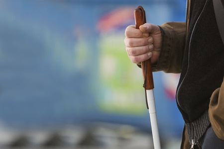 blind man hand holding cane